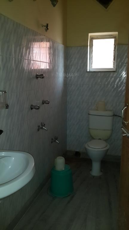 Готель Rupasi Bangla Колката Номер фото